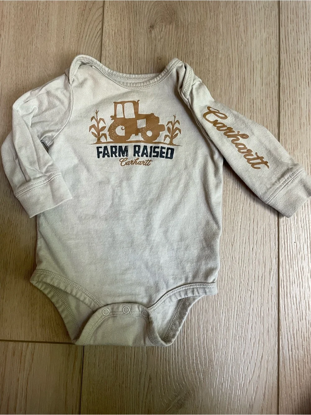 Carhartt Cream Baby Long Sleeve Onesie with Yellow Logo